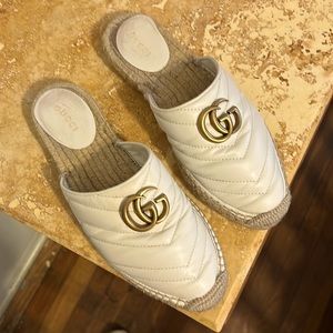 Used Gucci white leather mules with straw foot bed. Size 36 1/2. GG emblem.